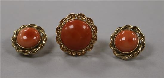 A yellow metal and cabochon coral dress ring and a pair of similar 9ct gold earclips.